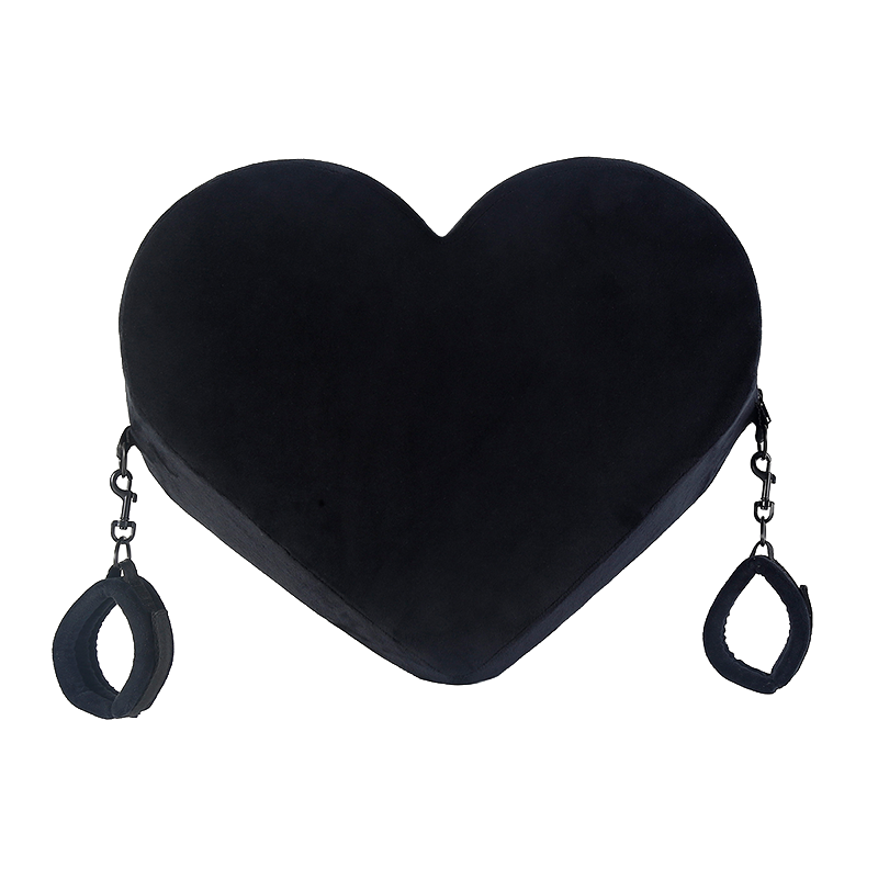 Black heart-shaped pillow with cuffs on both sides